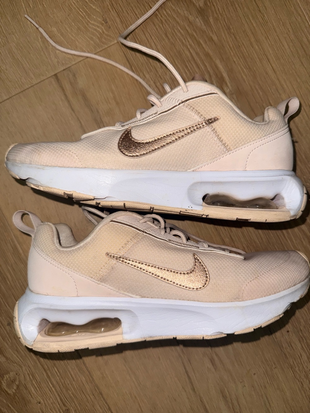 Nike Women’s Light Pink Sneakers with Metallic Rose Swoosh